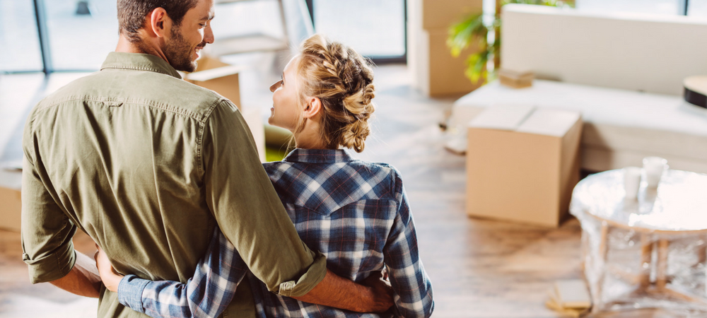 couple moving into new house because of First-Time Homebuyers’ Loans