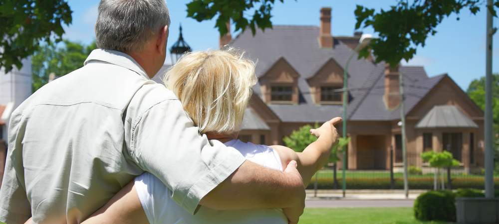 couple looking at house needing Jumbo Home Loans